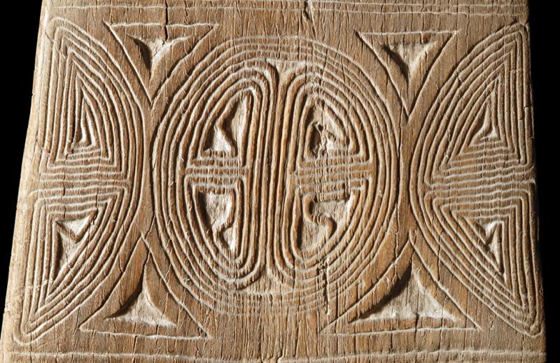 Wood carved with repeating lines