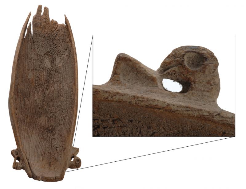 A carved wooden platter with closeup of the handle
