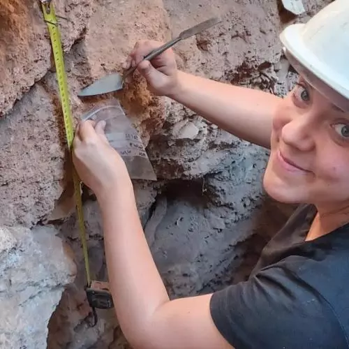 Danielle taking samples in the trench