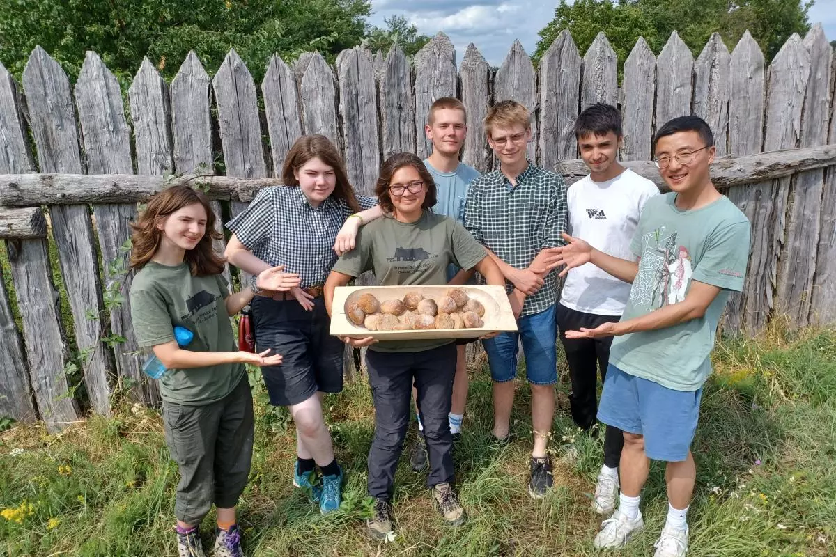 A group of undergraduates proudly display their Lorsch bread