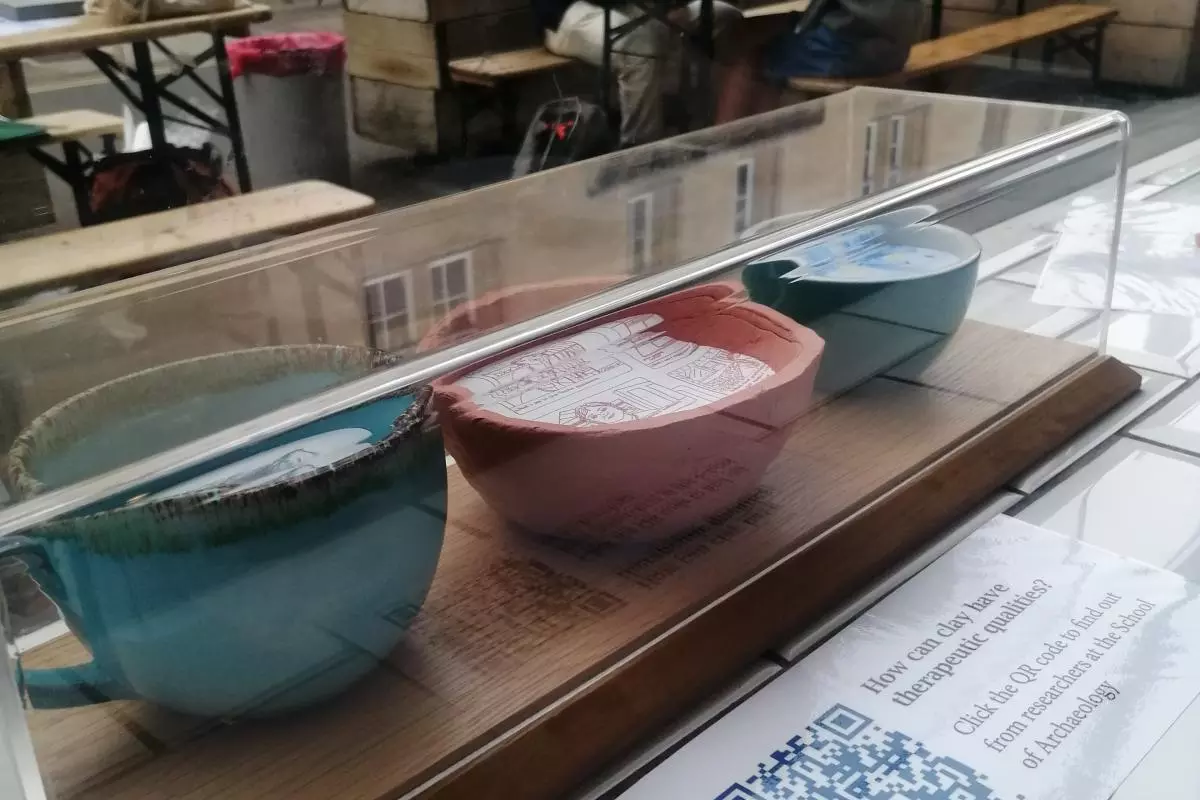 Photo of an archaeology inspired art installation in the front window of the Turl Street Missing Bean cafe